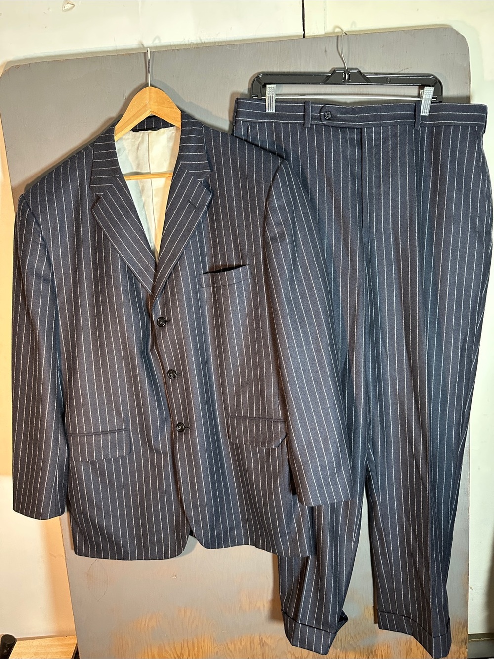 Men's Navy Pinstripe Three-Button Suit Jacket with Matching Trousers